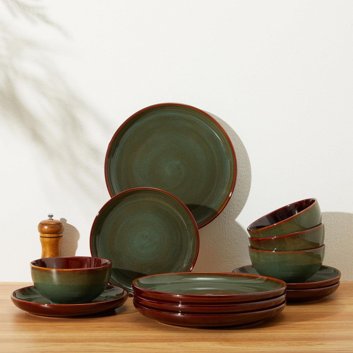 Pokini sage green dishware set arranged on a table for elegance