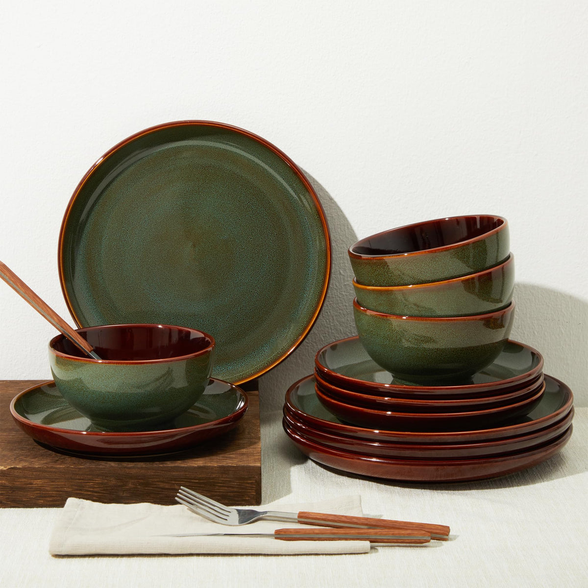 Pokini sage green stoneware on rustic kitchen display for casual gatherings