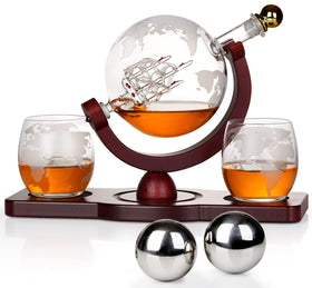 PONPUR whiskey globe decanter with ship detail enhances a refined home bar display.