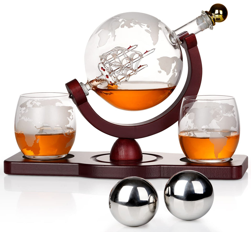 PONPUR whiskey globe decanter with ship detail enhances a refined home bar display.