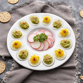 Potchen deviled egg tray top view shows 12 grooves for organized buffet-style serving.
