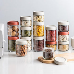 Povinmos jars organize lunches and pantry staples like spices and seeds.