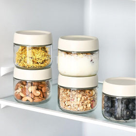 Povinmos transparent jars help fridge organization at a glance.