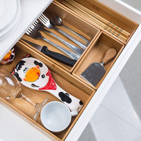 PRATIQUE bamboo drawer organizer close-up shows smooth finish and compact design.