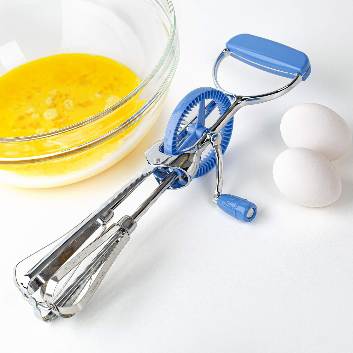 Prepworks egg beater turn-handle design starts beating action for quick mixes.