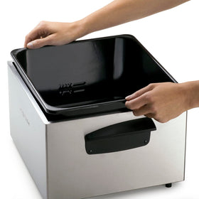 Fryer cover with charcoal filter reducing splatter and odor.
