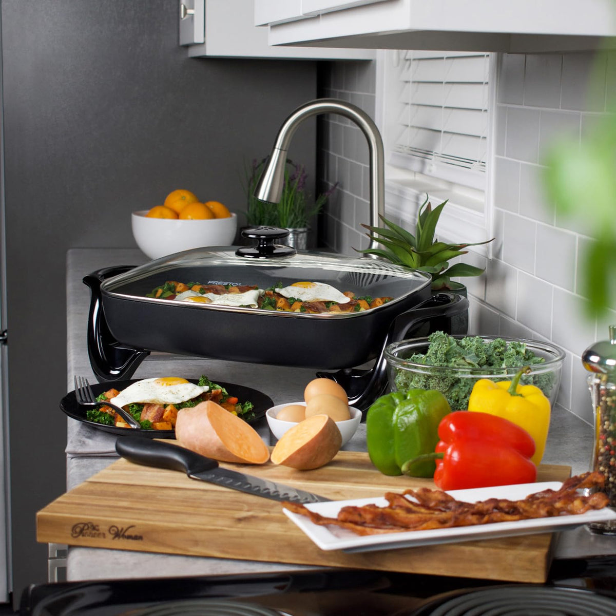Presto 06852 skillet with heavy cast aluminum base demonstrates warp-proof durability for steady cooking.