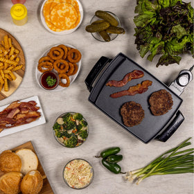 Presto Liddle Griddle with grease tray keeps drippings neatly collected.