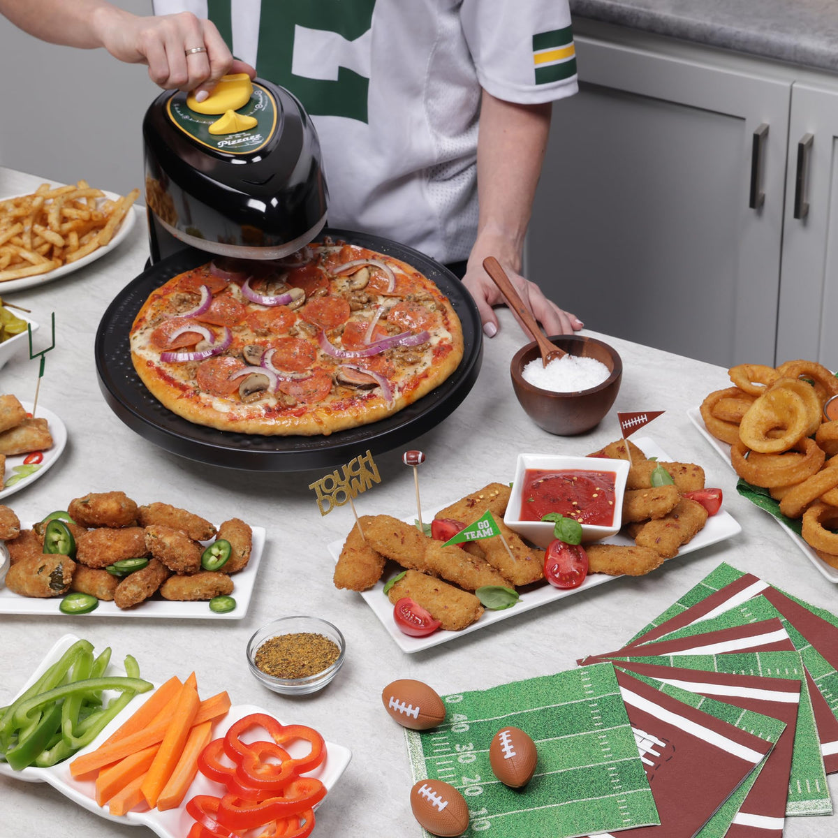 Compact countertop Presto Pizzazz Plus on a kitchen counter for quick meals.