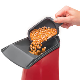 Built-in butter melter and measuring cup on the Presto Poplite for convenient topping