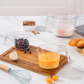 PRETTYFINE clear plastic cups with multiple scales for quick, accurate recipe prep.