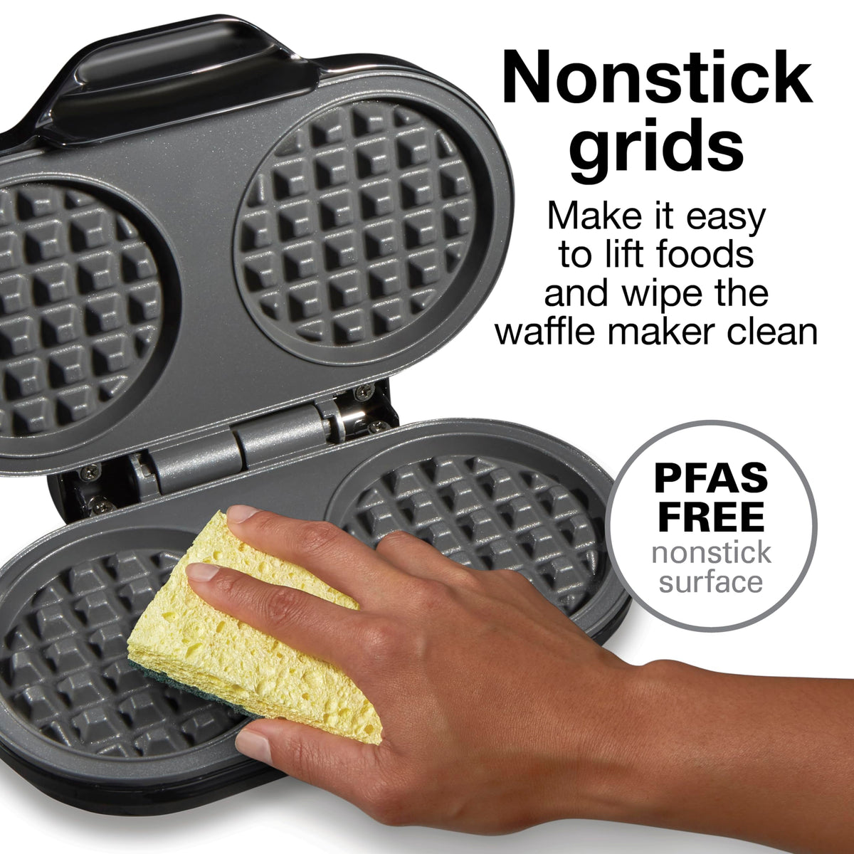 Opened waffle maker shows two waffles cooking in the compact appliance
