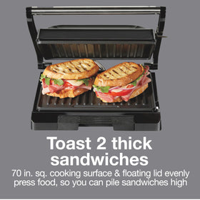 Proctor Silex Panini Press with two sandwiches cooking on the surface