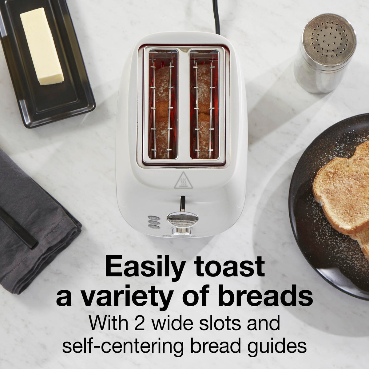 Proctor Silex toaster bagel button illuminated for consistent bagel toasting.