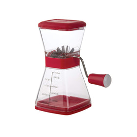 Progressive PrepWorks Nut Chopper chopped nuts falling into the bowl during use.