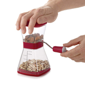 Progressive PrepWorks Nut Chopper clear base shows 1 1/2 cup capacity.