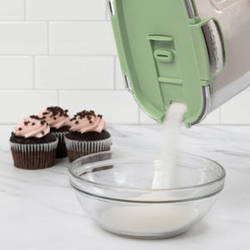 ProKeeper+ Magnetic dusting spoon stored under lid for easy powdered sugar dusting.