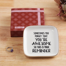 Pudding Cabin inspirational gift dish shown with birthday wrapping for a thoughtful surprise.