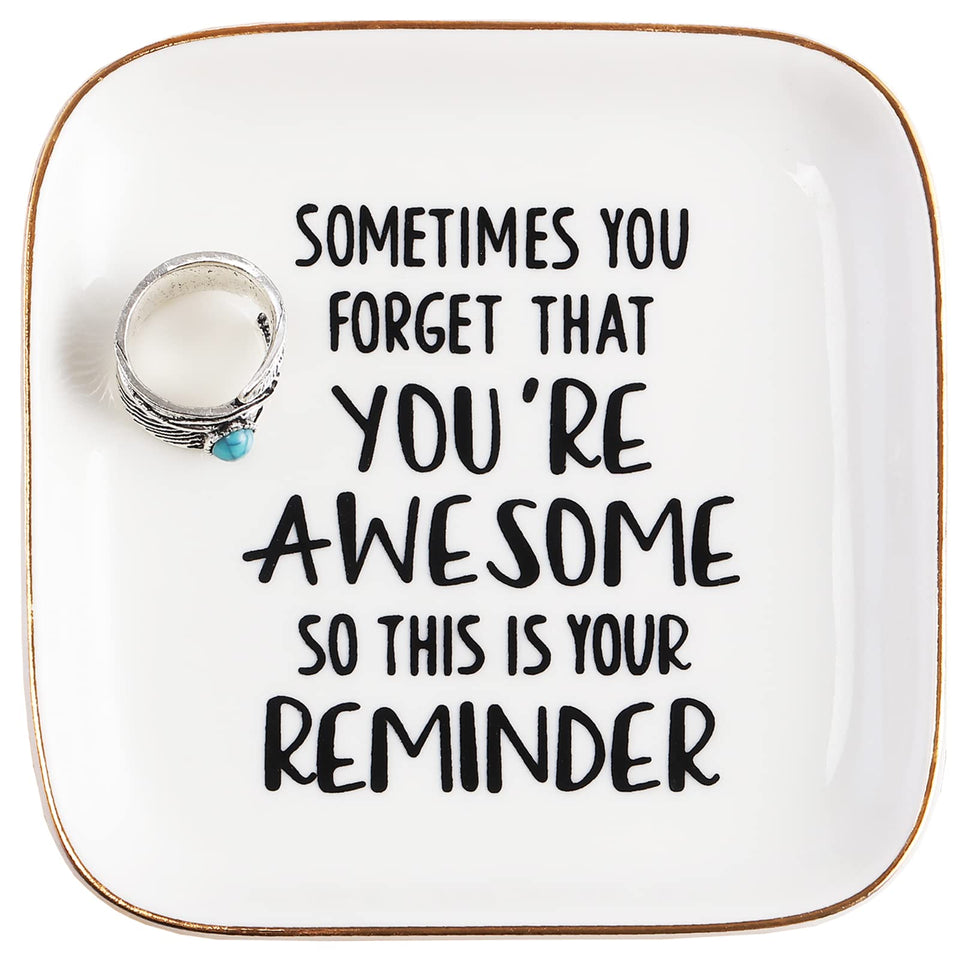 Pudding Cabin You're Awesome ring dish on a dresser keeps rings organized and accessible.