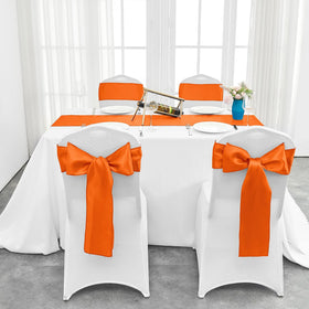 Pufogu orange satin table runner in banquet display adds festive color