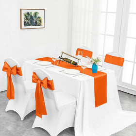 Pufogu orange satin table runner across dining table elevates party atmosphere
