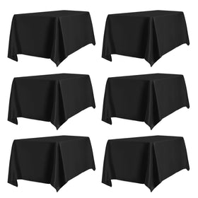 PureFit 6-pack black 60x102 tablecloth drapes neatly over 6 ft tables for events.