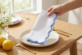 PurpleEssences closeup scallop taupe-stitch napkin highlights delicate border detail for refined gatherings