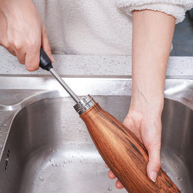 Purtribe compact brush stored easily on a hook or in a caddy
