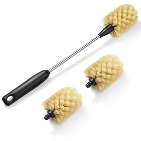 Purtribe long-handle bottle brush reaching the bottom of a tall bottle for thorough cleaning