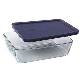 Pyrex 4-pack set of glass dishes with dark blue lids for organized storage.