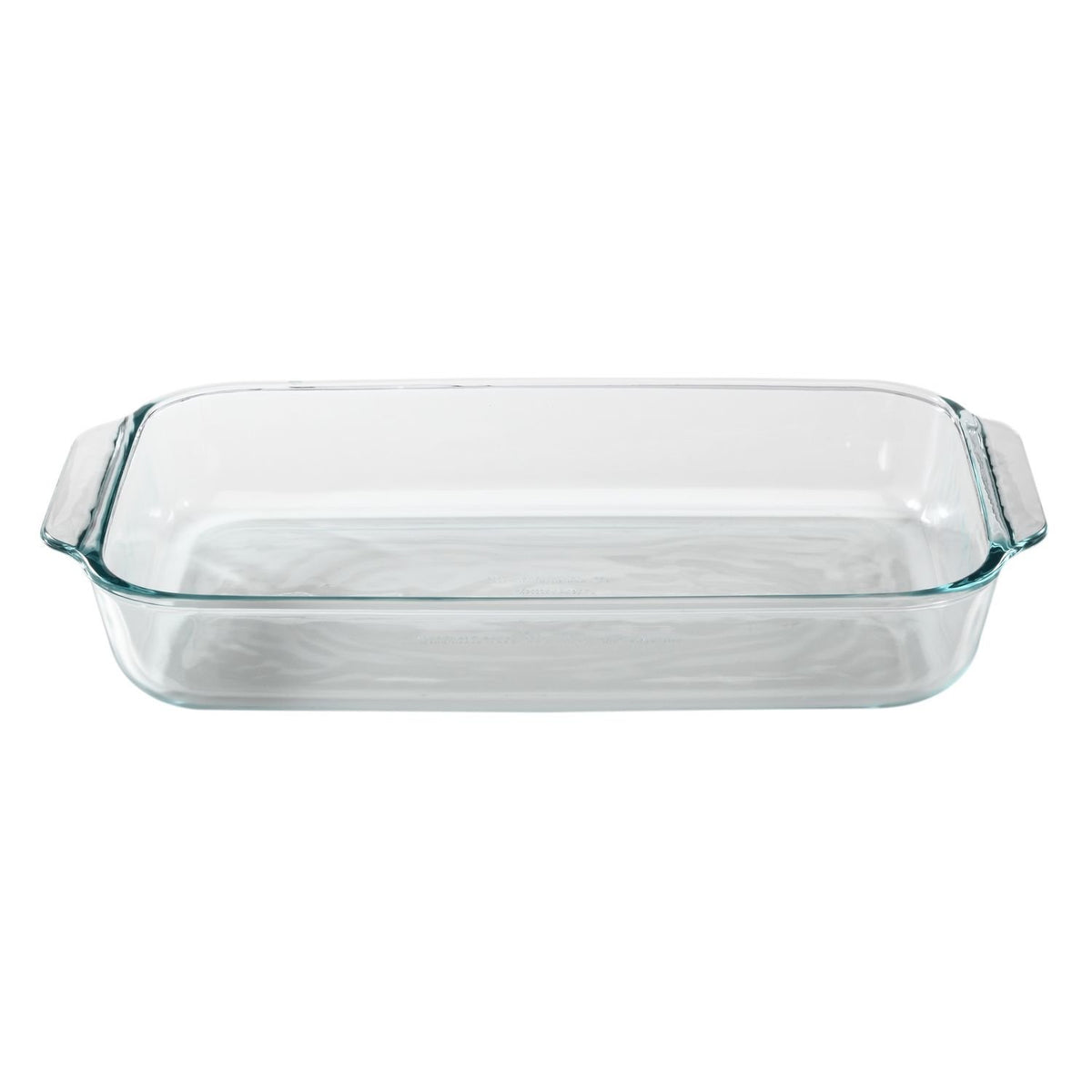 Pyrex dish with red lid ready for storage on the kitchen counter.