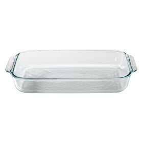 Pyrex dish with red lid ready for storage on the kitchen counter.