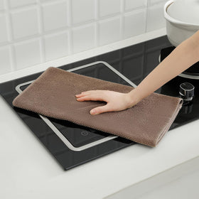 QAJ towels with hanging rings for easy drying and accessible storage.
