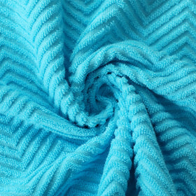 QAJ wave-pattern towels demonstrate enhanced absorption during spills.