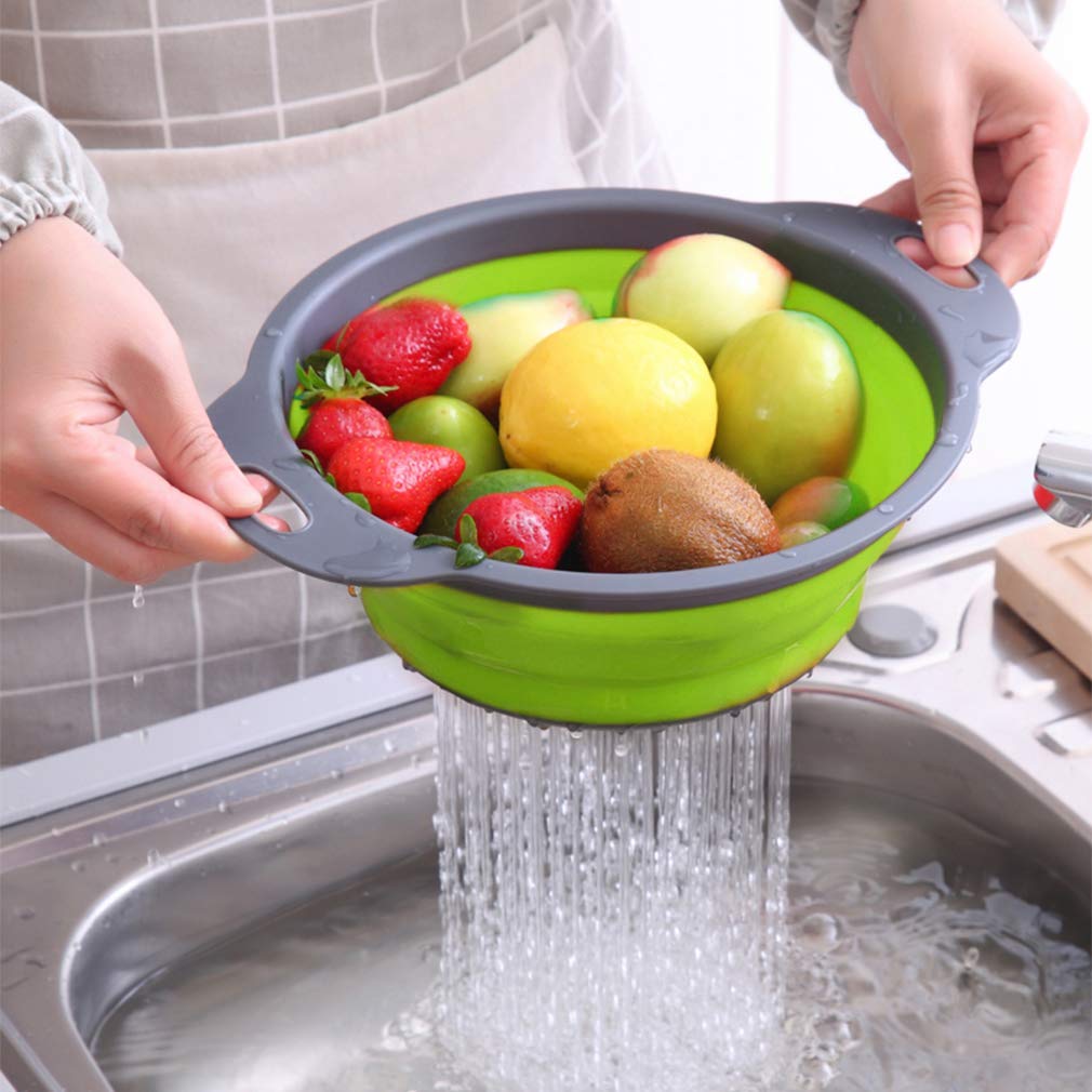 QiMH collapsible colander collapsed for compact storage in a drawer.