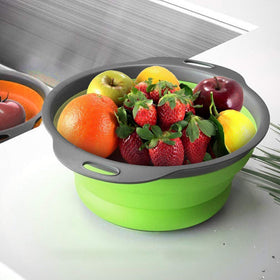 QiMH collapsible colander during pasta drain demonstrates versatile kitchen use.