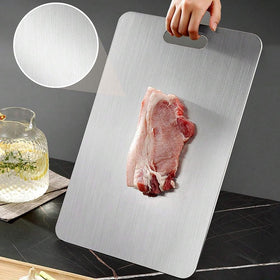 QINOSHMO titanium cutting board handles meats, fruits, and vegetables with a hygienic surface.