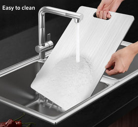 QINOSHMO titanium cutting board close-up shows a smooth surface for easy cleaning.