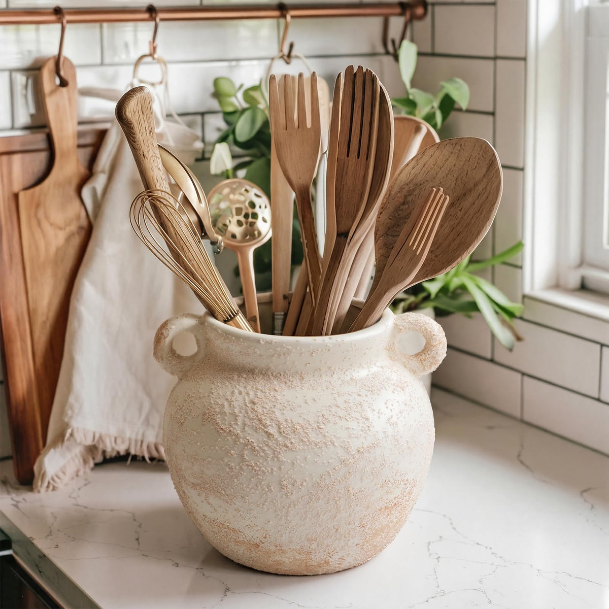 Qinyoung ceramic utensil holder wide opening for easy insertion and removal of tools.