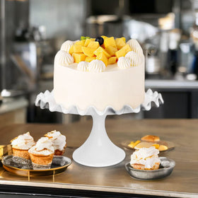 Quegroot cake stand displays fruits and desserts at gatherings
