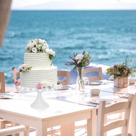 Quegroot white dessert stand in wedding setup for versatile display