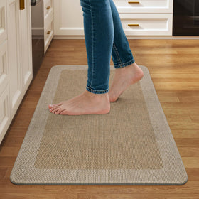 Quqei kitchen mat with non-slip backing helps prevent slips on smooth floors.