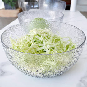 Qxbekmor break-resistant clear bowls provide safe service at events.