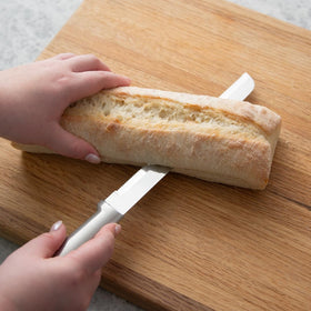 RADA 8-inch bread knife handle close-up with brushed aluminum grip