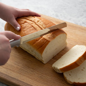 RADA 8-inch bread knife on cutting board slicing bread