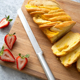 RADA bread knife slicing through crusty multigrain loaf with ease