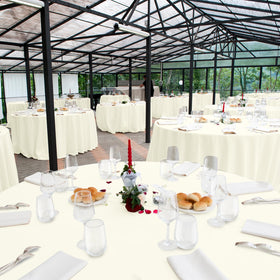 Ragnhild beige round tablecloth used for multiuse events and parties.