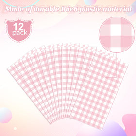 Ragnhild pink-white round gingham tablecloth setup for a party with centerpieces.