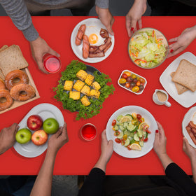 Ragnhild red tablecloth used for quick cleanup after a festive meal