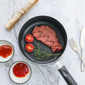 RATWIA tempered glass lid on small pot preserves heat and flavors.